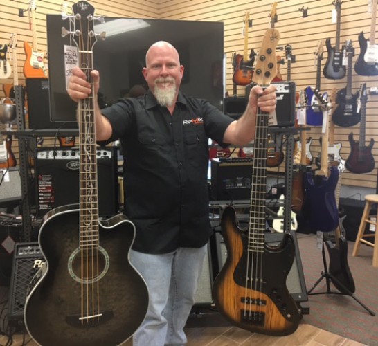 Michael Kelly acoustic and electric basses at ReMix Music store in Springdale, AR