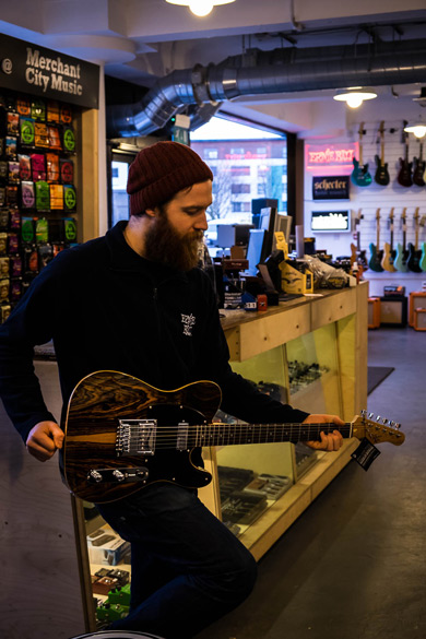 Merchant City Music staff playing with an MK 1950s Ebony electric guitar