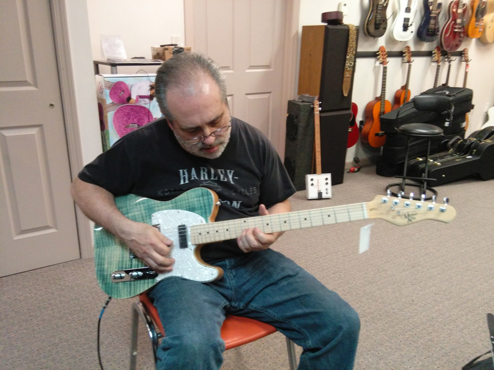 Student with a Michael Kelly 1950s electric guitar during guitar lessons at Robert Putt Studios.