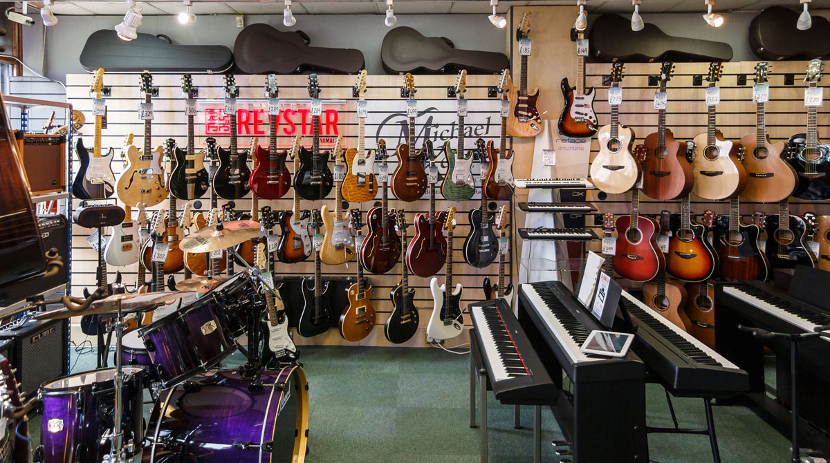 Electric and acoustic guitars at Strum & Bass music store