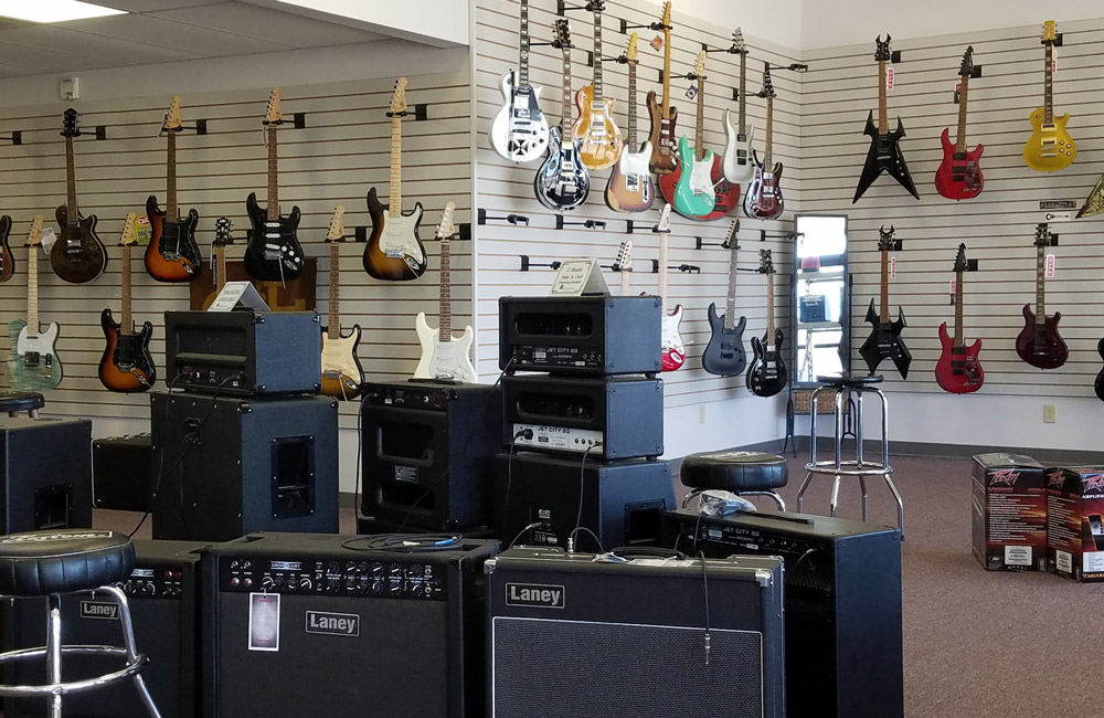 Electric guitars and amplifiers at The Musician's Den in Evansville, IN