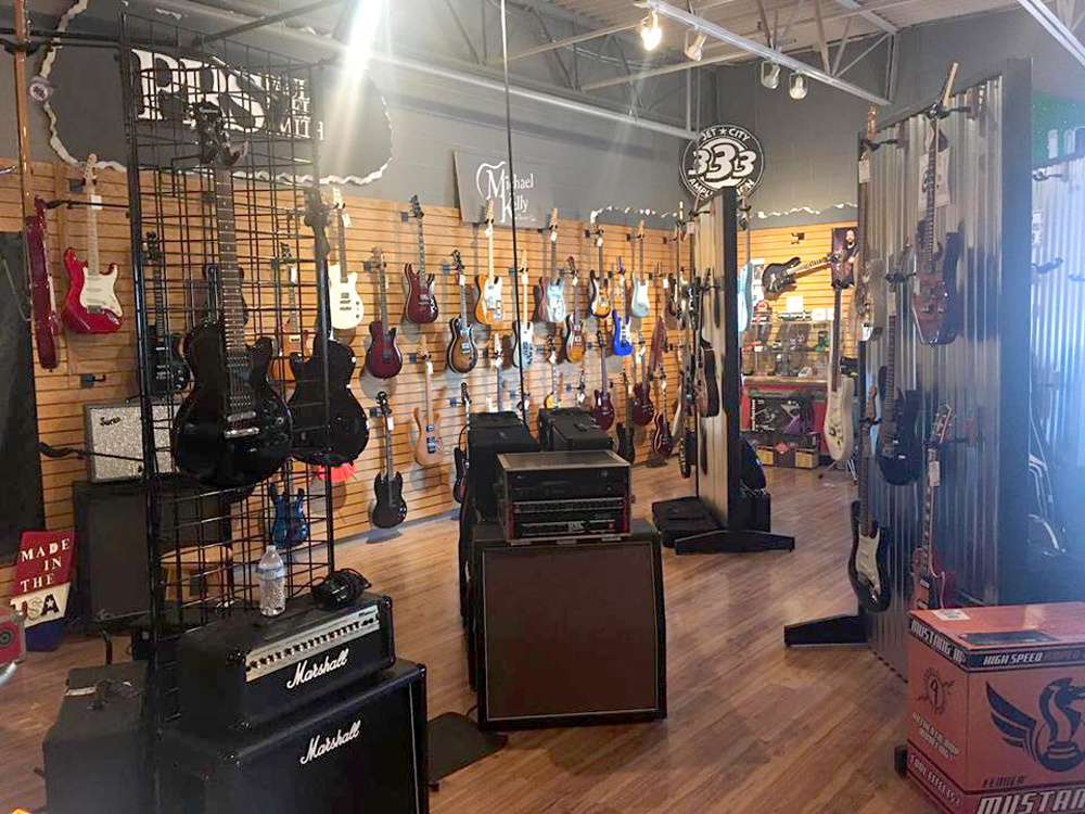 Michael Kelly 1950s, 1960s, and Patriot electric guitars and amps at Unga Bunga music store